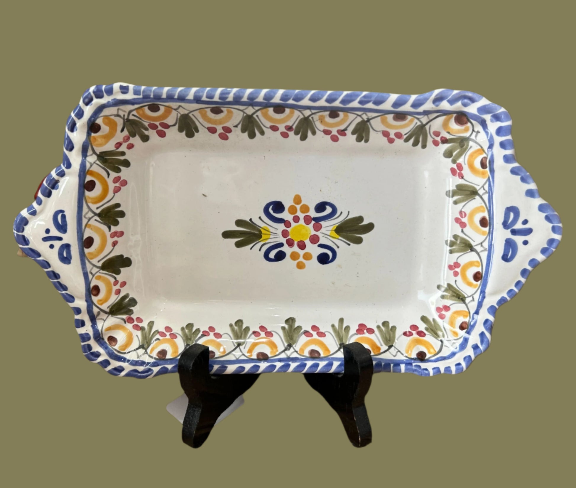 10-inch tapas tray, white background with hand-painted exterior blue edging and green, yellow, red and blue abstract floral interior edging and center design