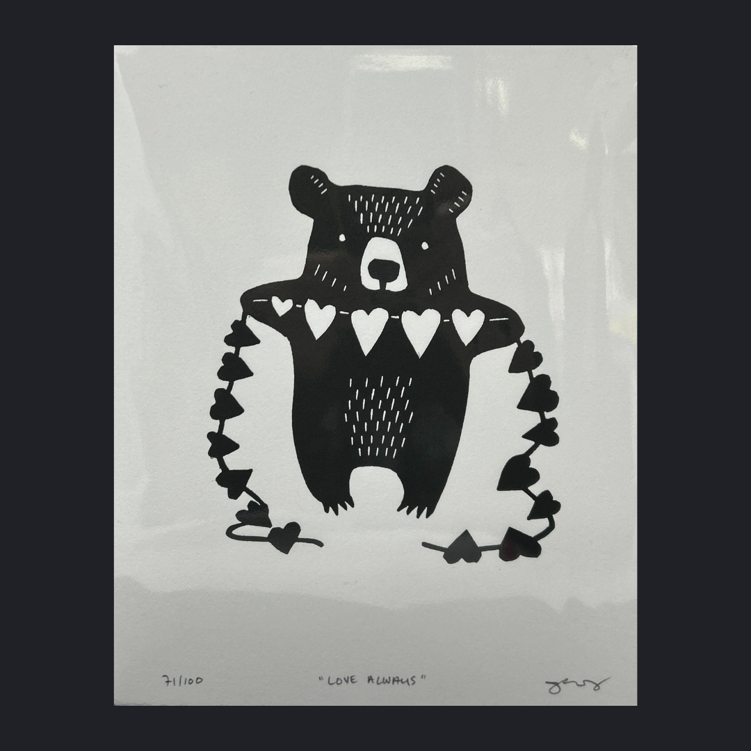 lino cut little bear holding string of hearts; black hearts appear on his sides while hearts across his chest are white