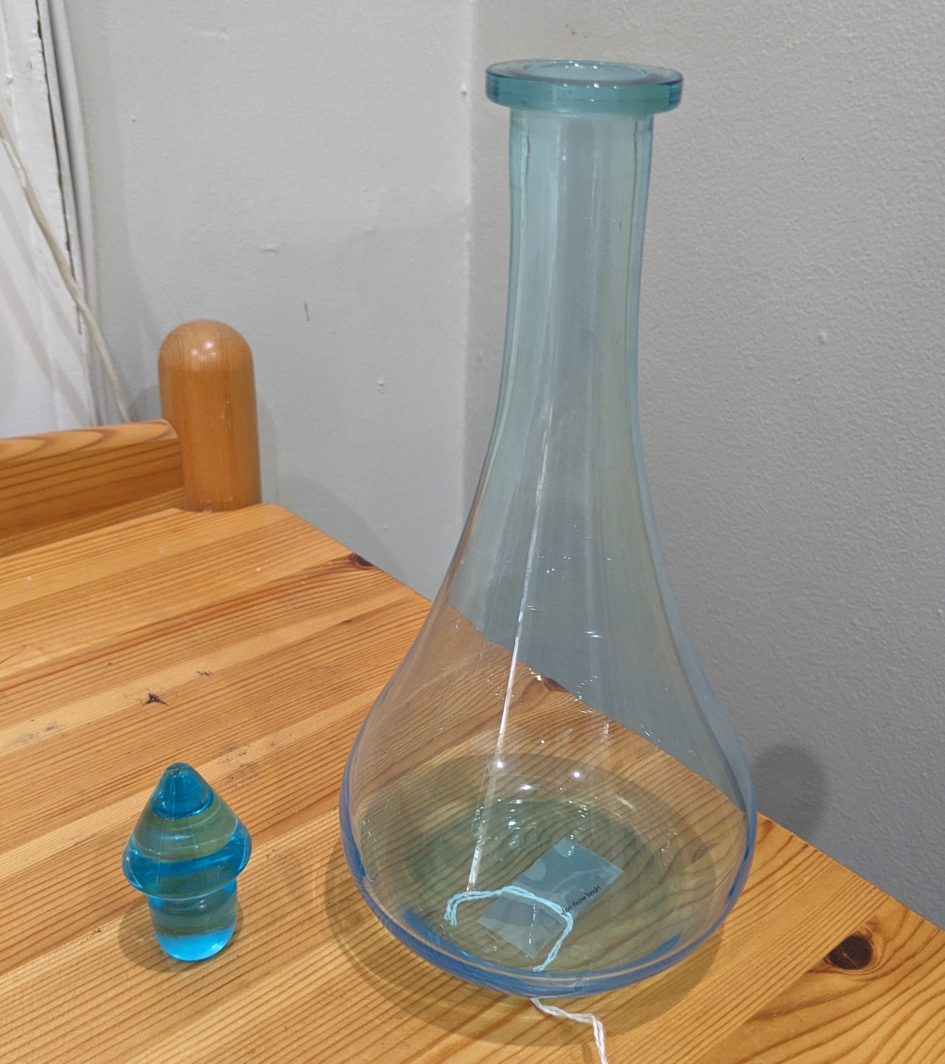 Replica of an apothecary show globe bottle, aqua glass with glass stopper