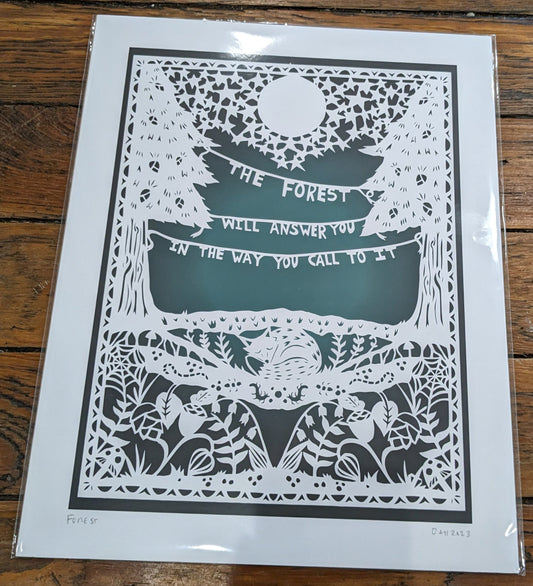 White papercut on gradient teal background featuring the Finnish proverb ” The forest will answer you in the way you call to it”