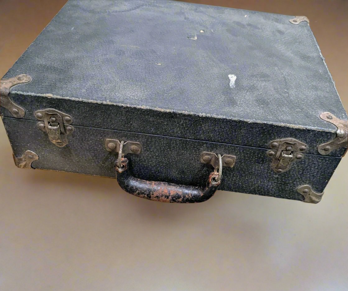 vintage leather briefcase with aged patina and brass hardware