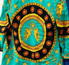 Upclose look at back of tunic detailing showing black oval framing golden cherubs