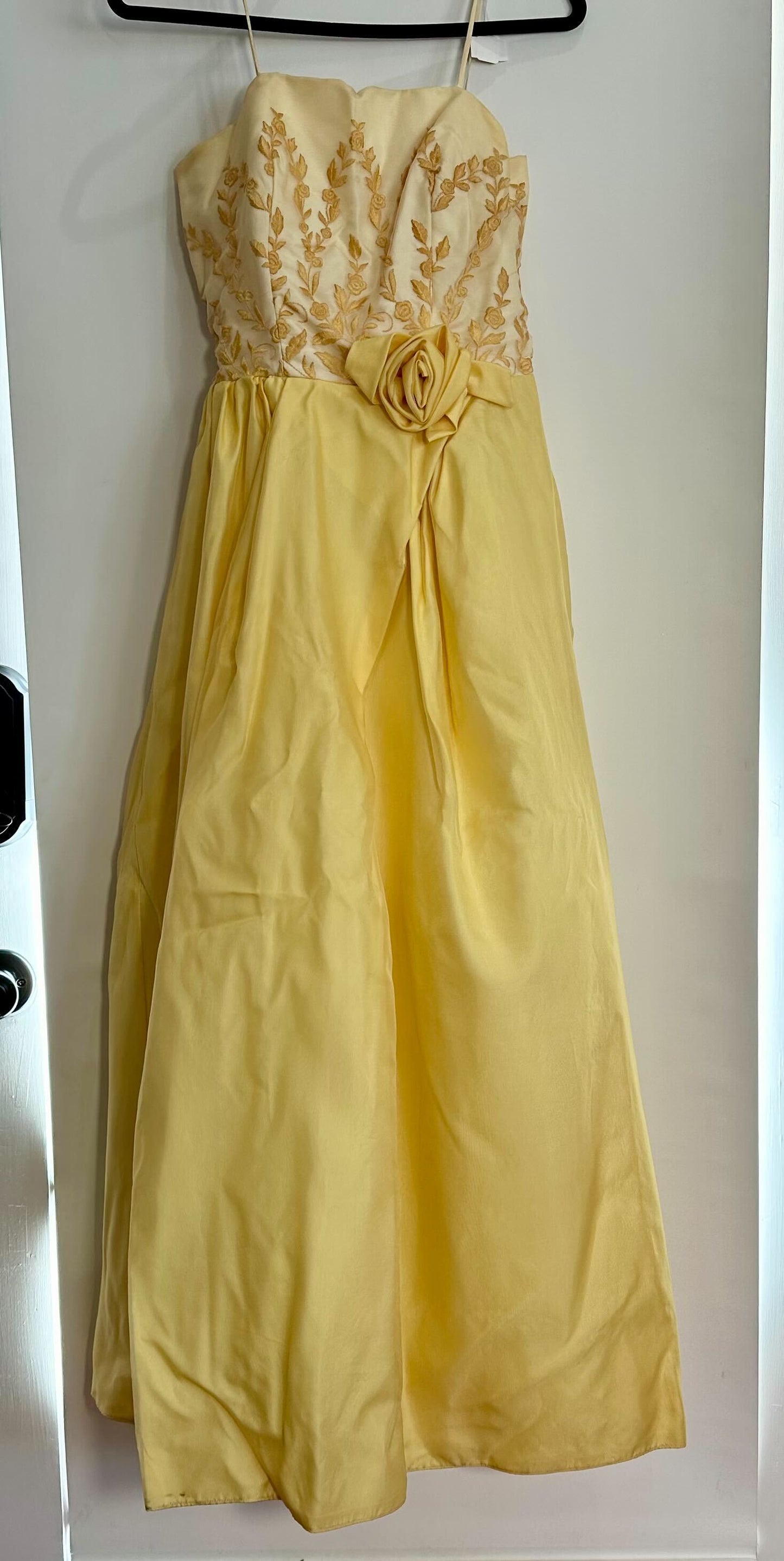 Spaghetti strap gown with yellow skirt (including fabric rose fixed at center waist) and golden torso (with floral embroidery detail)