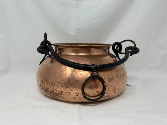 Small copper cauldron with black metal handle
