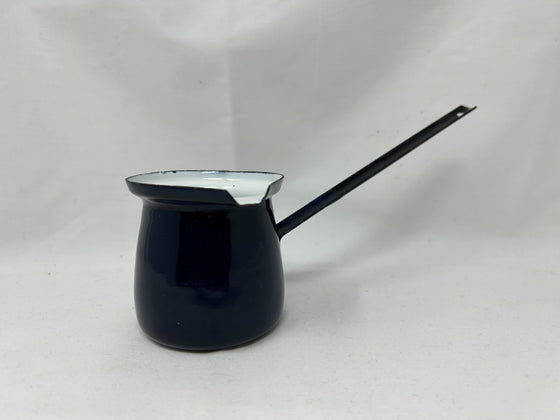 Black (white interior) enamel dipper, could be used as a butter melter/sauce warmer