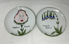  Pair of art plates with surrealist plant images; one reads "Phattfacia Stupenda," the other reads, "Manypeeplia Upsidedownia"