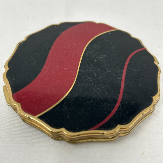 Vintage Stratton compact, black lid with red and gold wavy stripes
