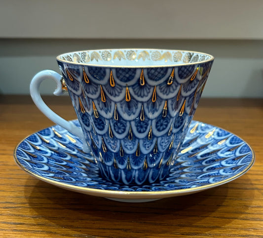 Russian porcelain tea cup and saucer, blue scale design with gold embellishments