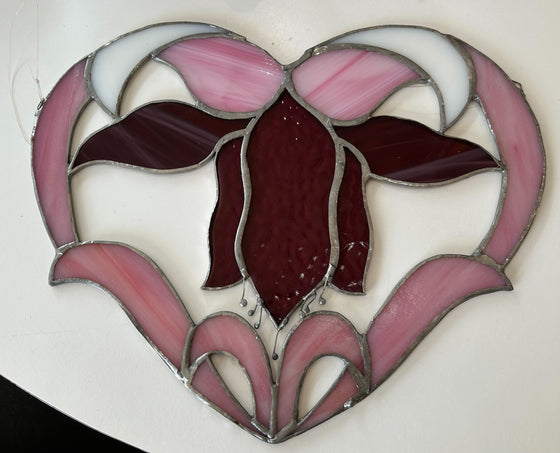 Floral heart with fuchsia, burgundy, and white hues of stained glass