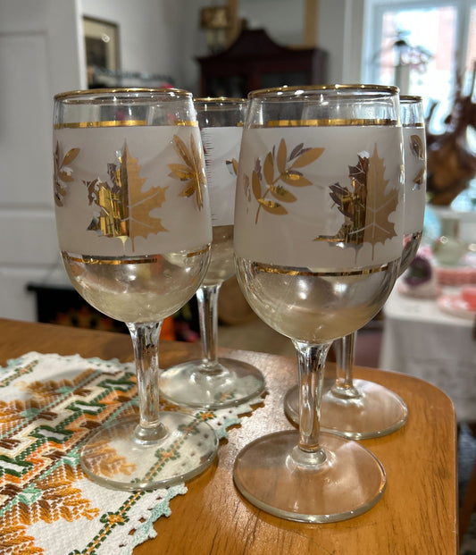 Frosted glass drinking goblets stemmed with gold leaf pattern and gold rim