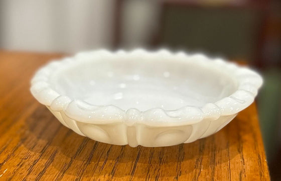 Vintage milk glass trinket dish with scalloped edges and soft indentations
