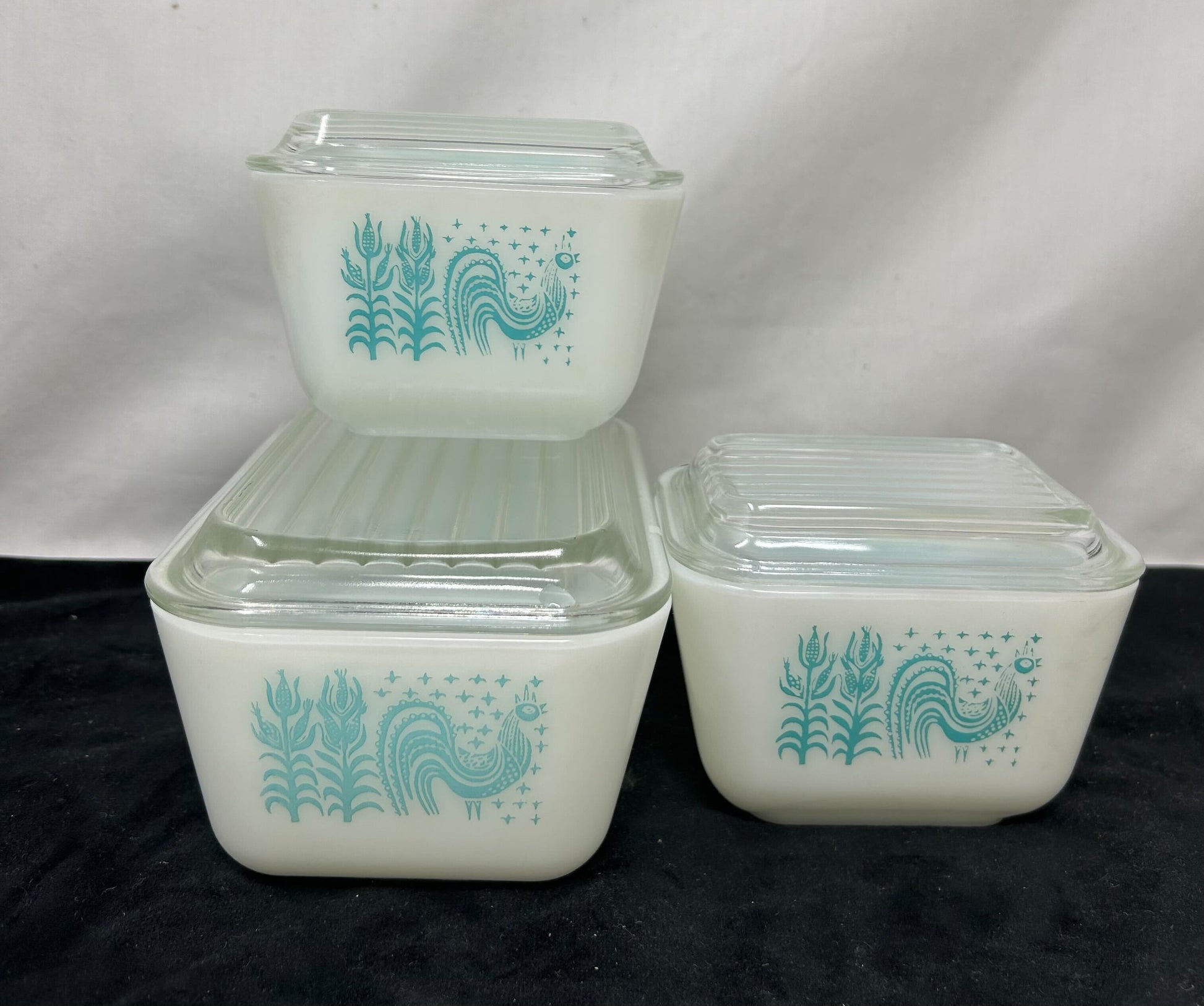 Three-piece Pyrex dishes—white base with turquoise design, clear glass top