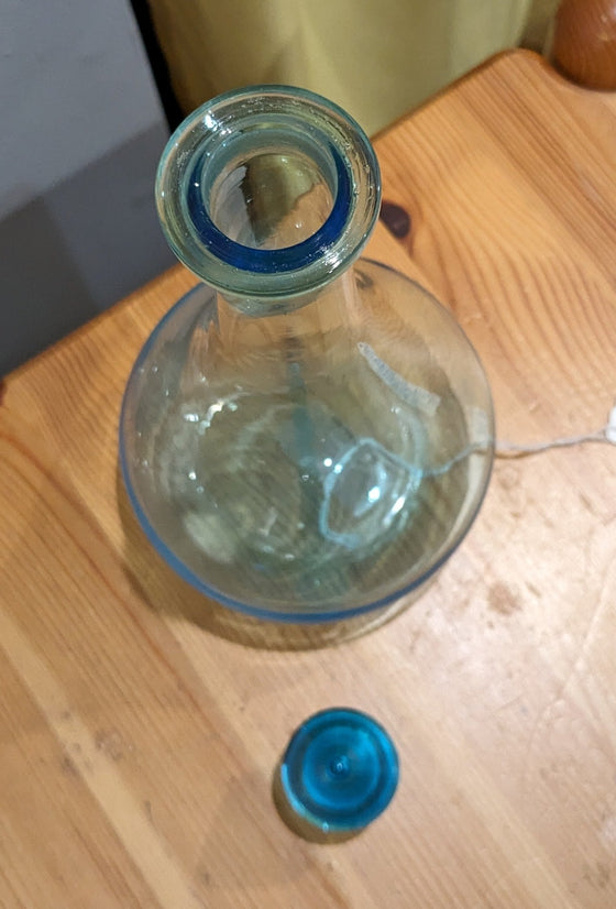Replica of an apothecary show globe bottle, aqua glass with glass stopper