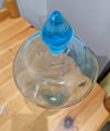 Replica of an apothecary show globe bottle, aqua glass with glass stopper (bottom view)