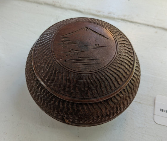 Round box with lid, textured carvings with mountaintop etched on lid