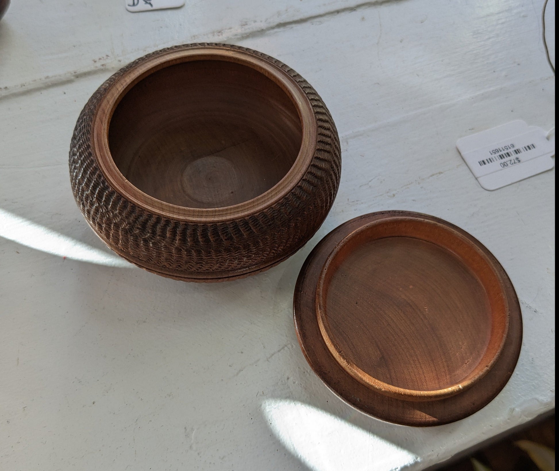 Round box with lid, textured carvings with mountaintop etched on lid