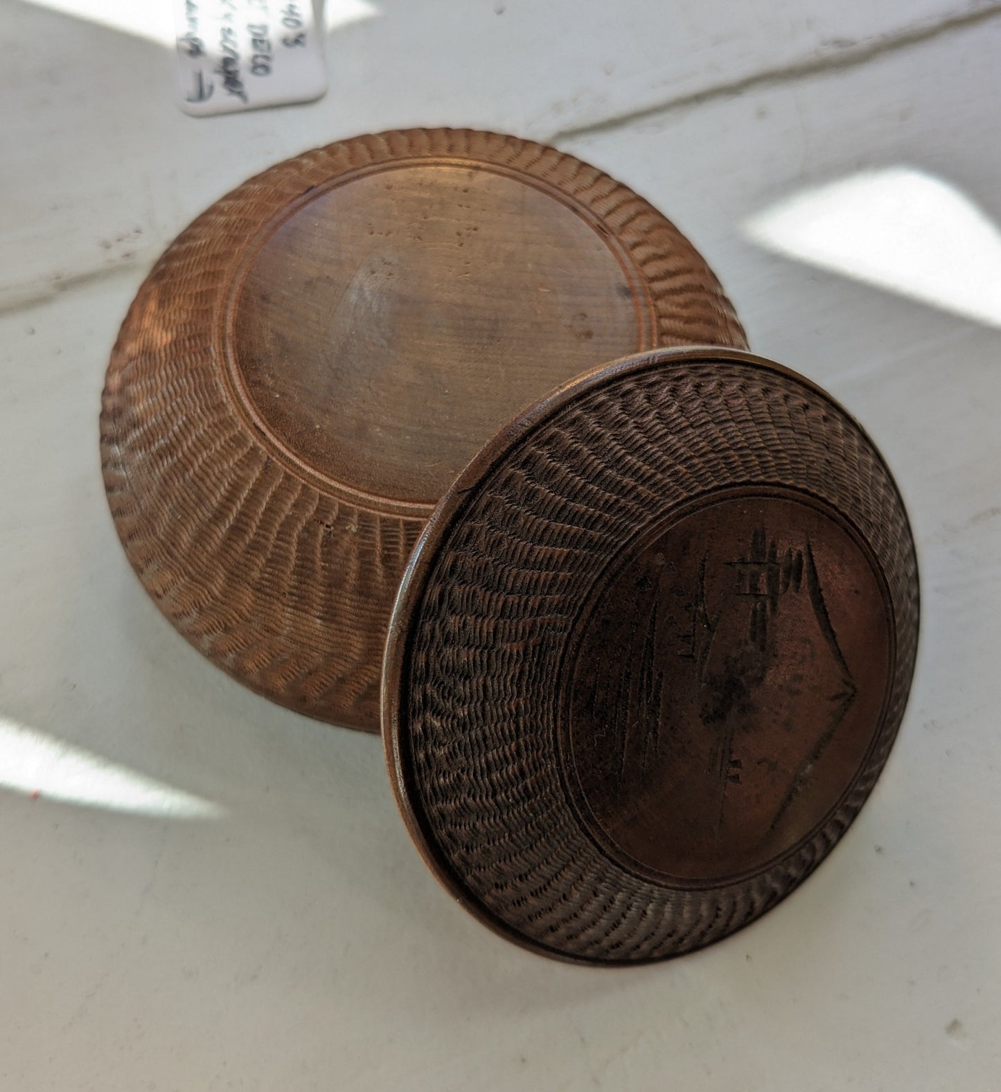 Round box with lid, textured carvings with mountaintop etched on lid