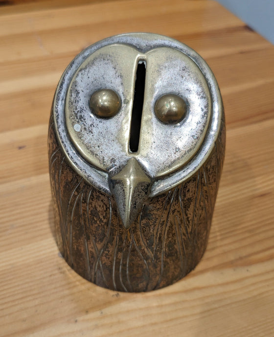 Modernist metal "owl" bank with 3D eyes and beak, and etched feathers