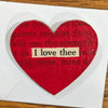 Red heart-shaped pin with text transfer highlighting "I love thee"