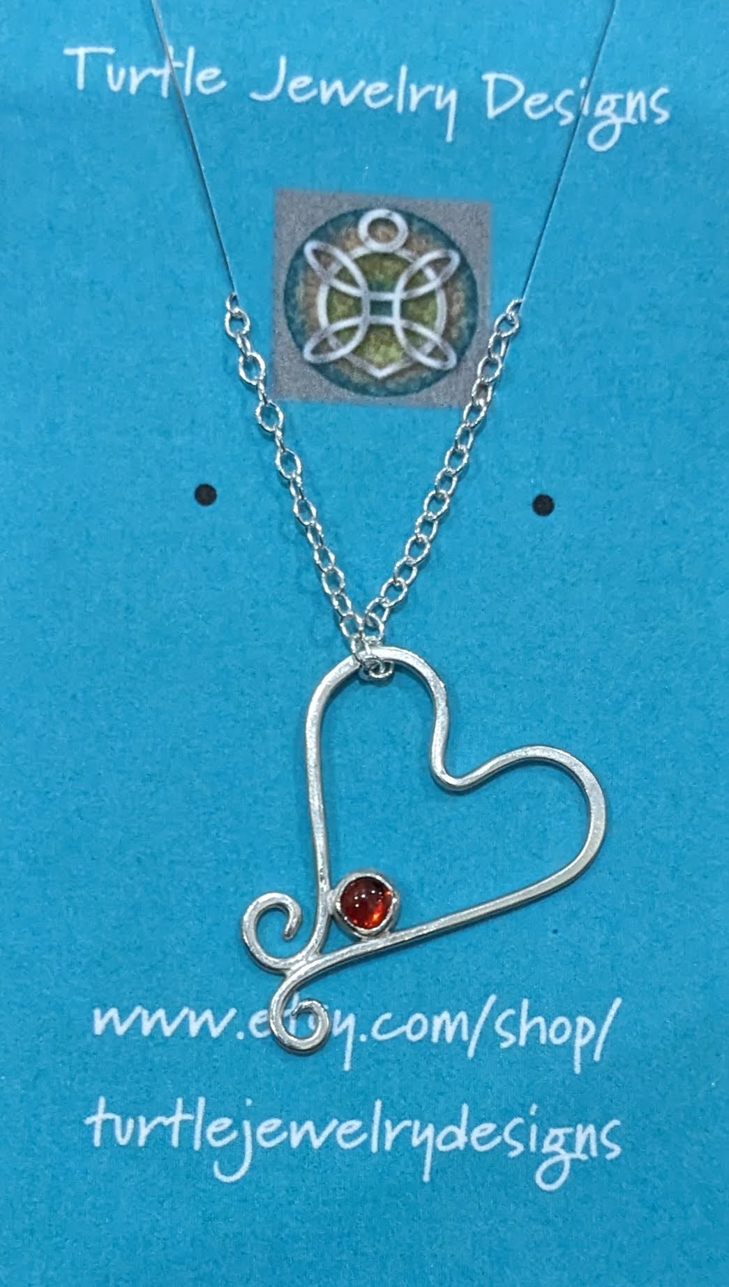 Silver wire heart with garnet cabochon on 18" chain