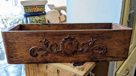 Rectangular wooden drawer with ornate 3D design on front