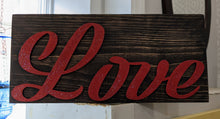  Woodblock sign reading "Love" in red glitter