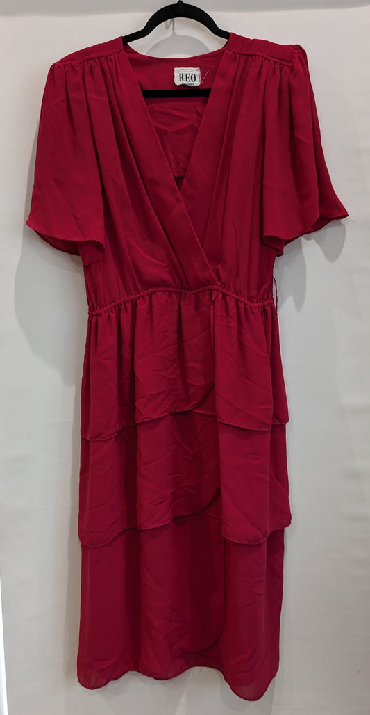 Red tiered dress with voluminous sleeves, cross-over V-neck