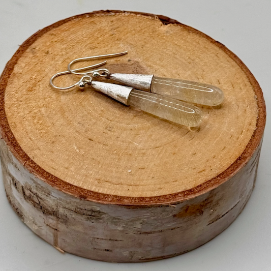 Sarah Wolfenden: Earrings of Rutilated (Golden) Quartz with brushed sterling cones